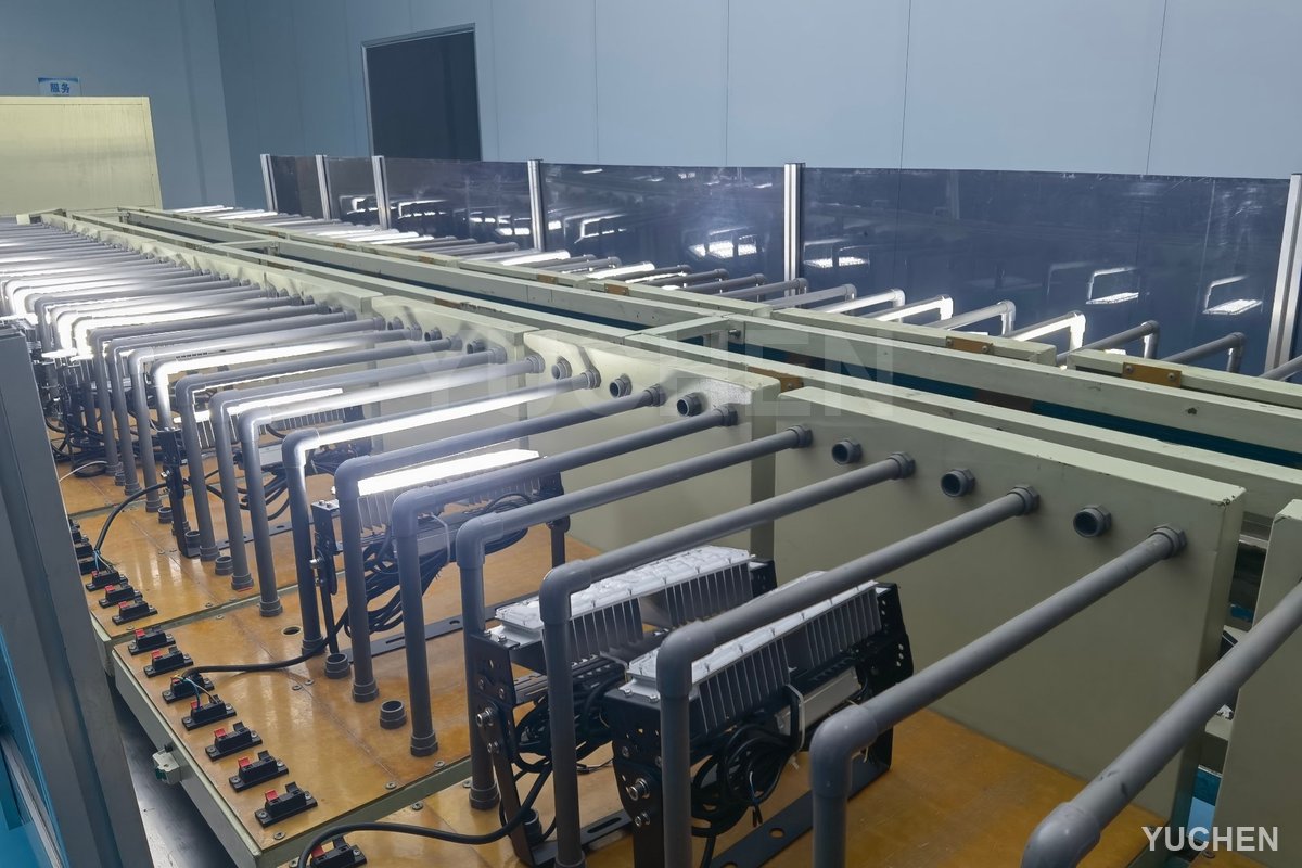 M1 floodlights on aging test racks in the factory